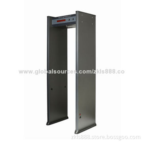 Walk through explosive detector with sensitivity adjustment
